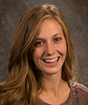 young woman with hair gracefully flowing off brow to shoulder