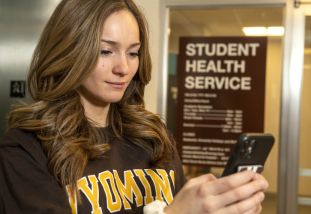 nursing student holding phone