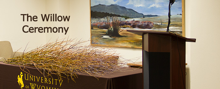 table filled with willow branches at a previous ceremony