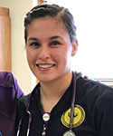 Miss Lensegrav, dressed in UW scrubs, with her preceptor at Powell Valley Health Care