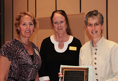 St. John's Medical Center representative accepts the University of Wyoming School of Nursing 2012 Community Partner of the Year Award from school faculty and dean.