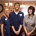 Three individuals in nursing care at Spring Wind in uniform