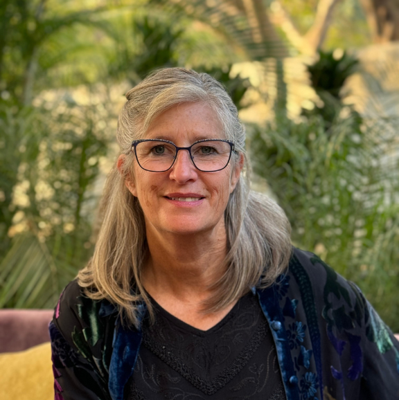 photo of maria kidner in a multi colored jacket