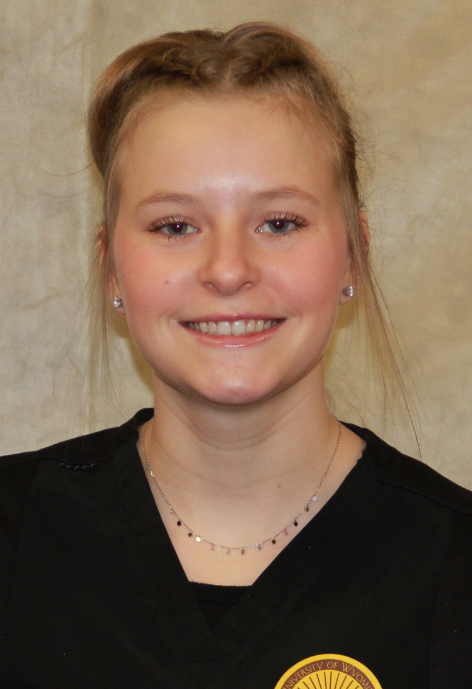 danielle mcgowan in black scrubs with a yellow patch