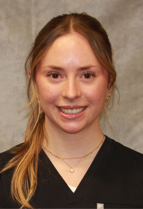 photo of devon barclay in black scrubs