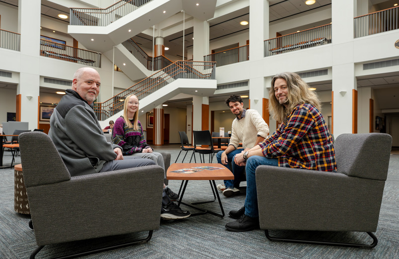 meeting in the college of business atrium