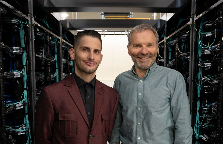 men standing in a server room