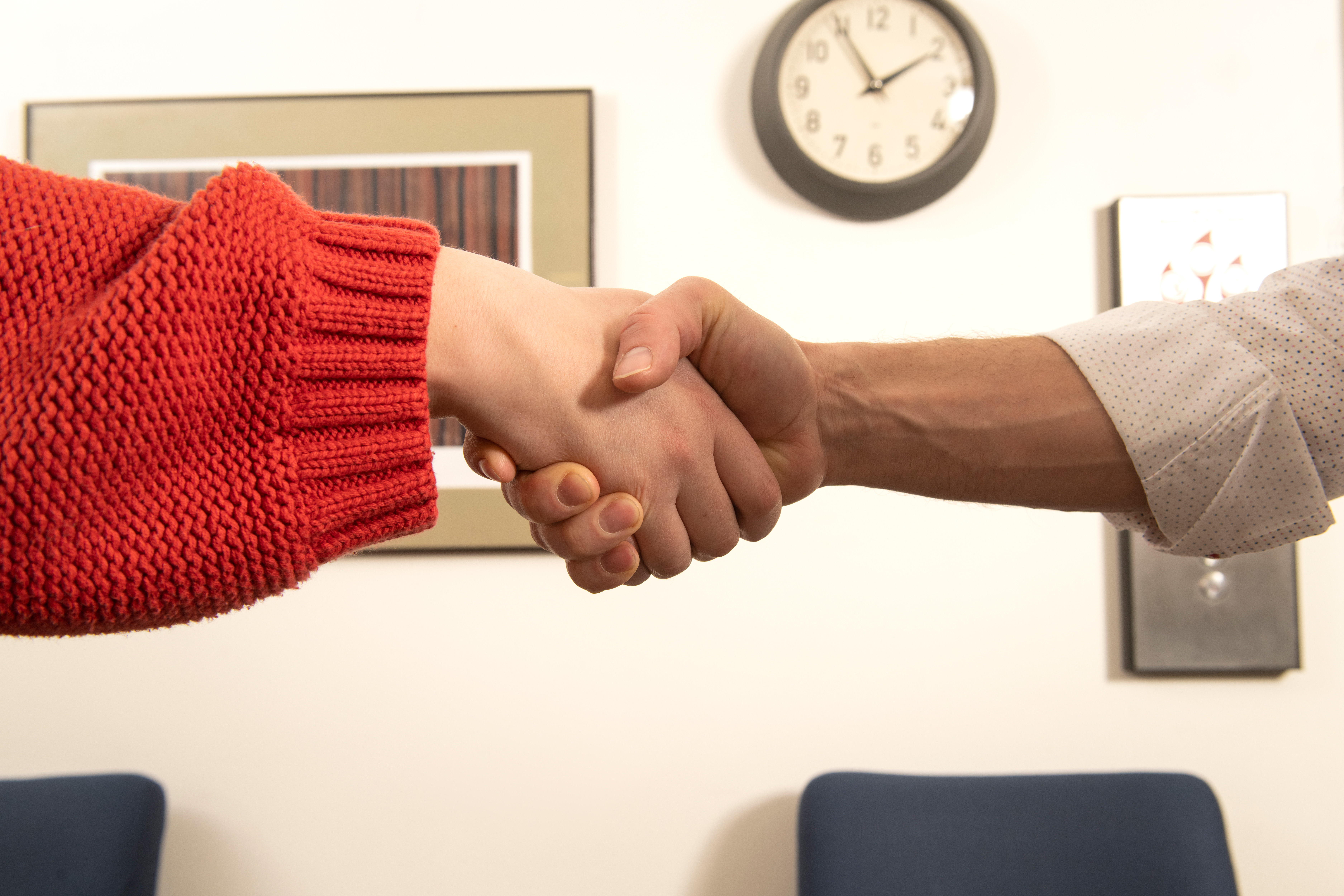 two arms shaking hands