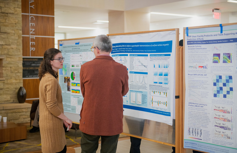 a presenter shows their research