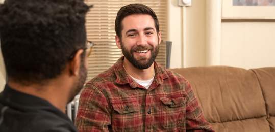 Person talking to staff memebers