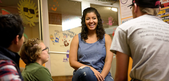 Person talking to students