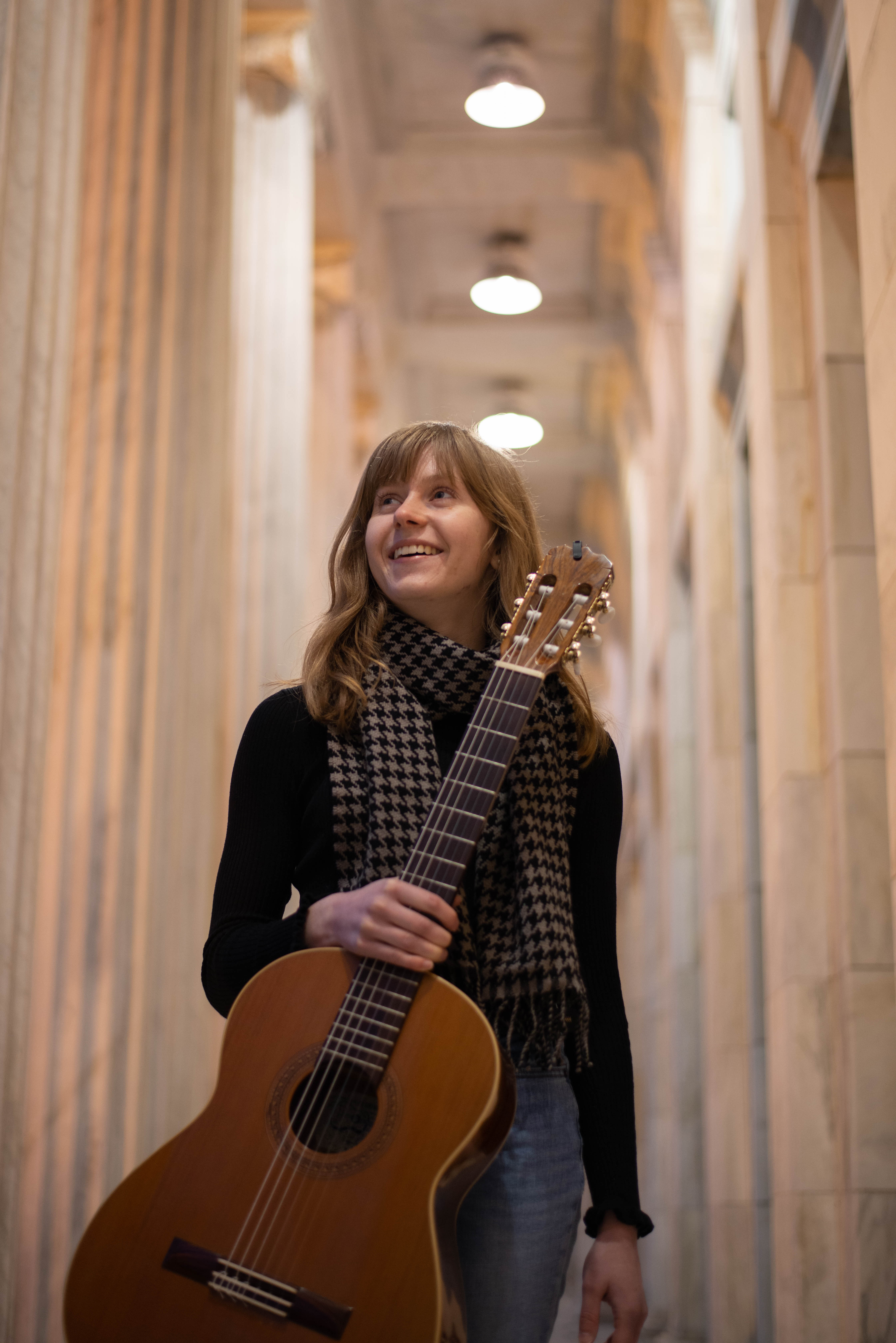 Ema Kurbos-Cooper with her guitar