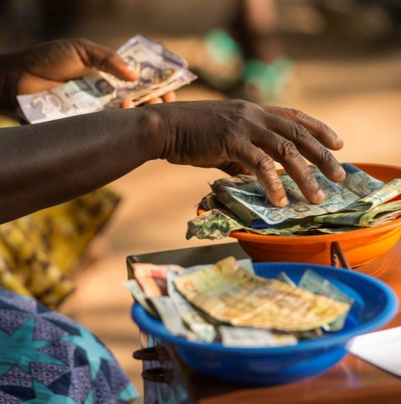 money at a business stall in ghana