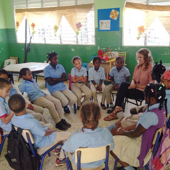 students in a circle in a classroom in the Dominican Republic