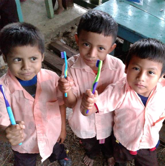 boys in central american with toothbrushes