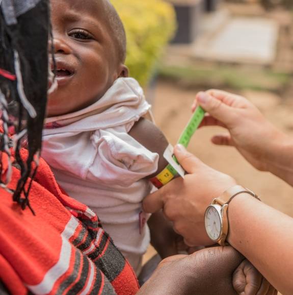 an infant getting a physical in Rwanda