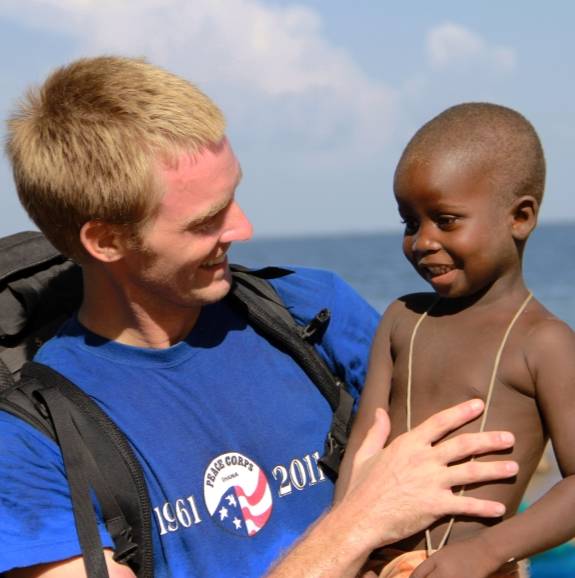 pcv in ghana holding a toddler