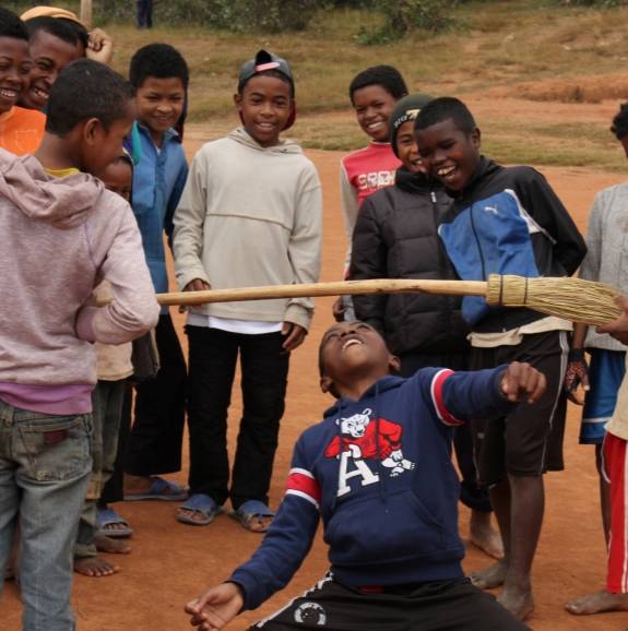 youth in Madagascar playing the limbo
