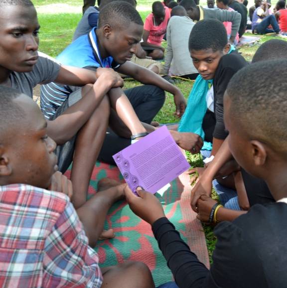 boys in Uganda learning about gender based violence