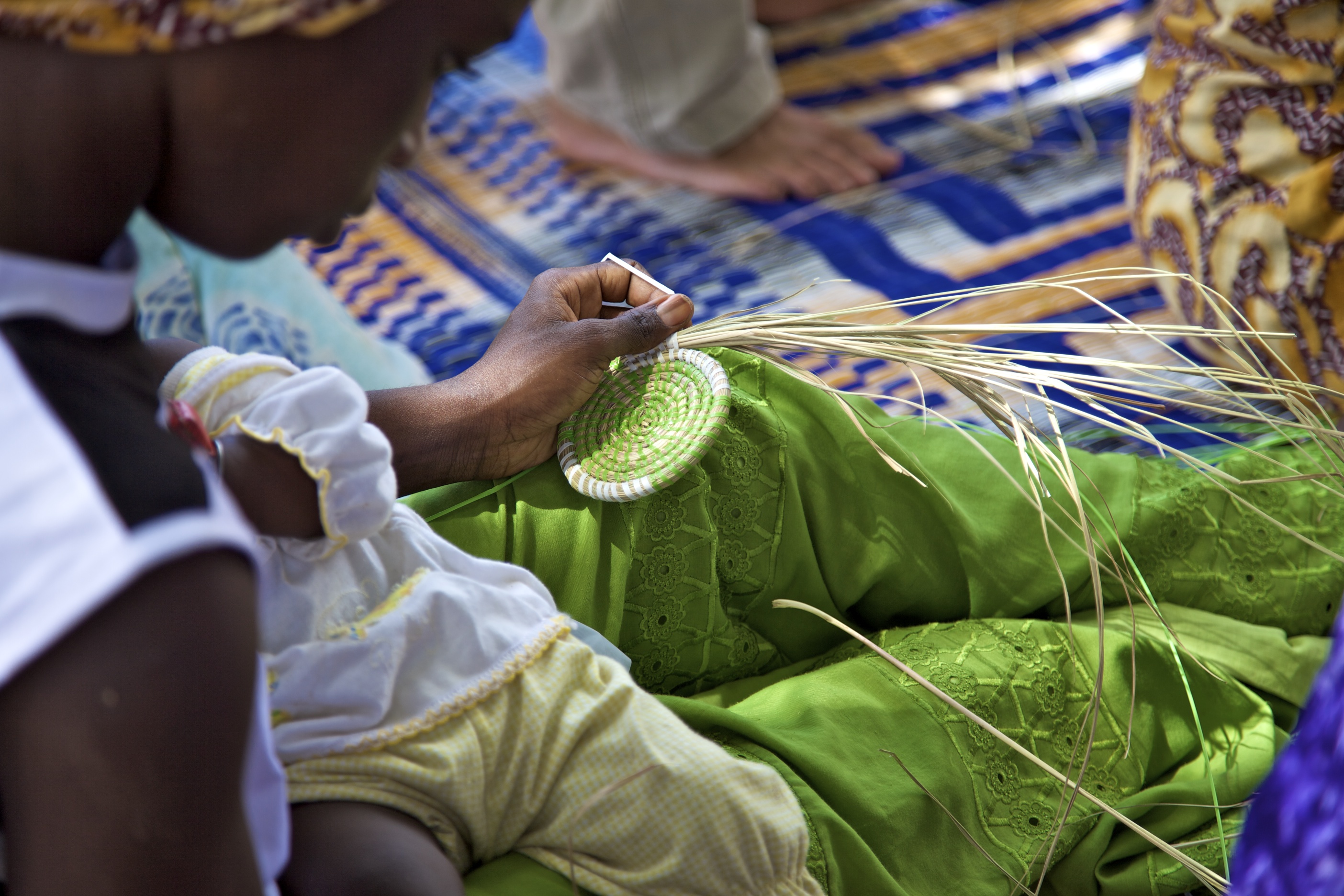 A woman creating crafts in Senegal