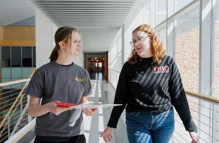 Picture of two students walking at the Enzi Stem building.