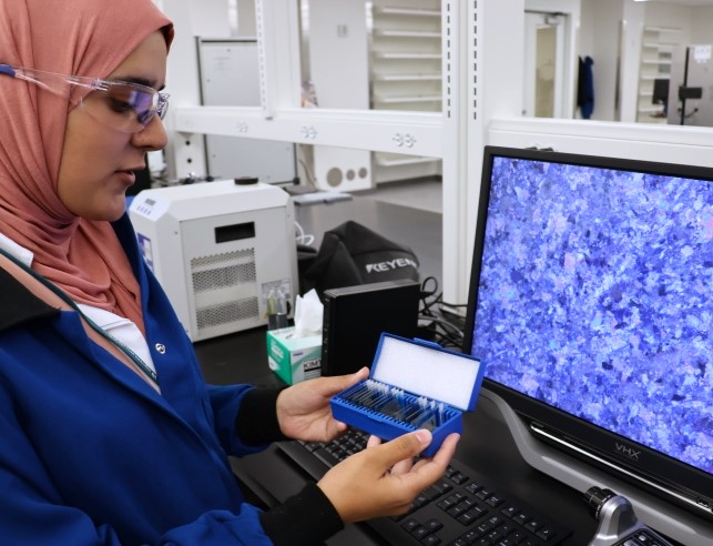 PhD student Djihane Gourari prepares slides for the Digital Microscope