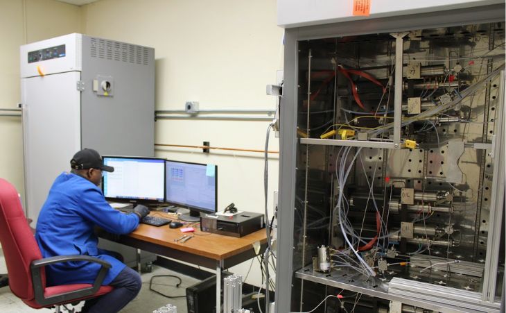Picture of graduate student researcher in the reservoir description and dynamics lab.