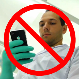 Image of man with photo crossed out by large, red X