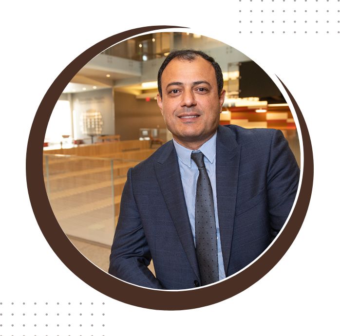 department head vamegh rasouli smiles at the camera
