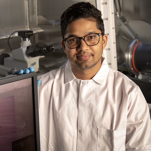Student smiling in a lab