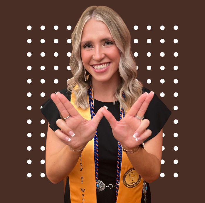 Student in graduation cords with brown background