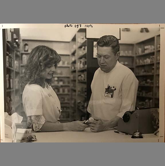 Two pharmacists working in a pharmacy. 