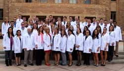 The University of Wyoming School of Pharmacy class of 2018 group white coat photo.