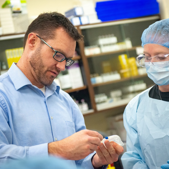 medical professional works with a student