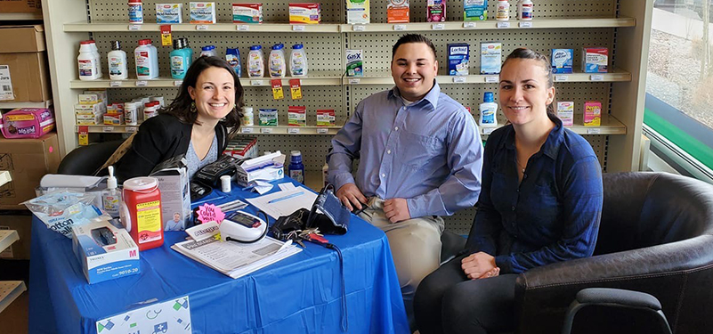 Pharmacy students sitting together at a table.
