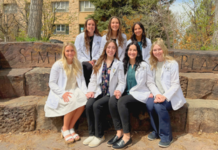 students in white coats