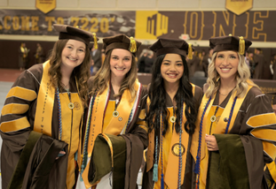 students in graduate robes