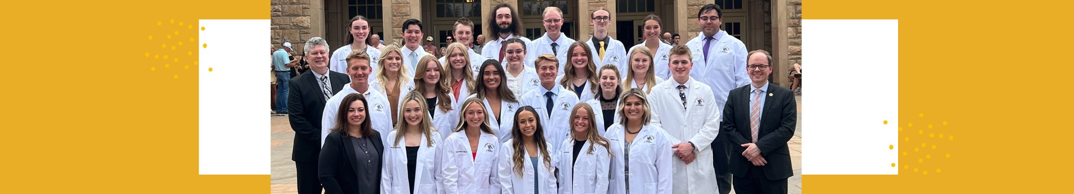 students in their white coats 