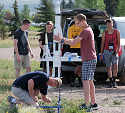 photo of summer camp student launching a rocket