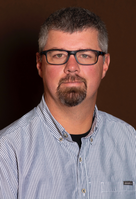 Man with glasses and striped shirt