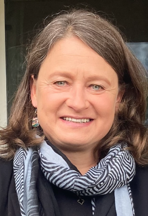 Smiling woman wearing black shirt with scarf