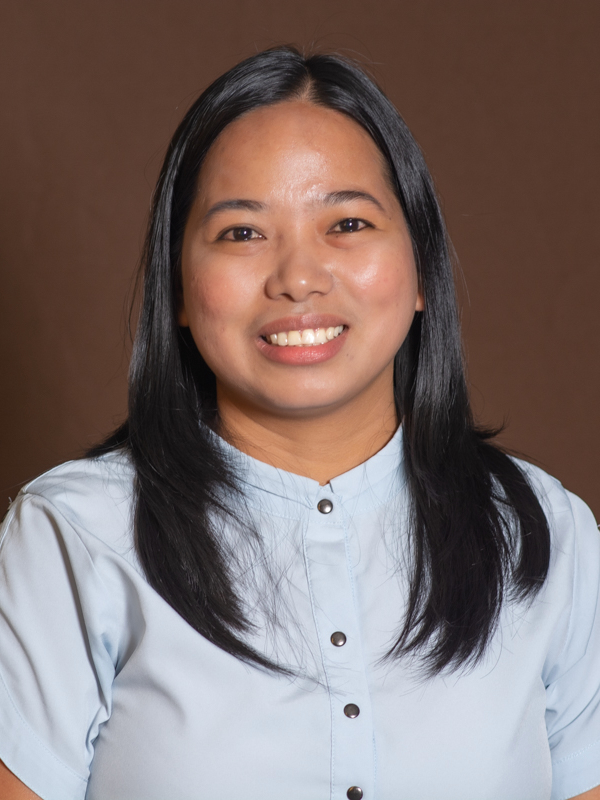 Smiling woman in light blue blouse