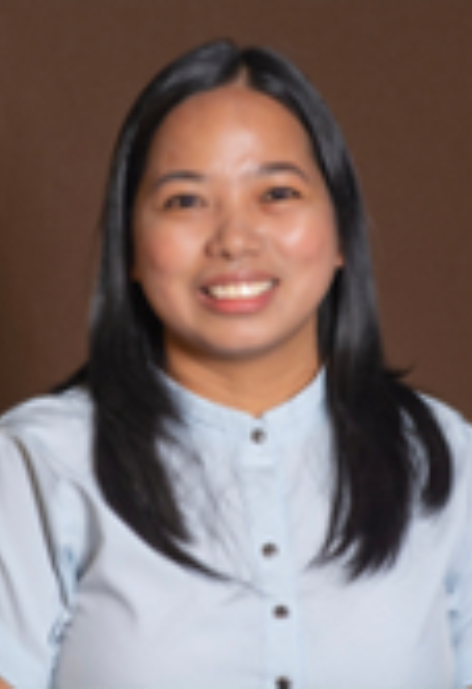 Smiling woman in light blue blouse