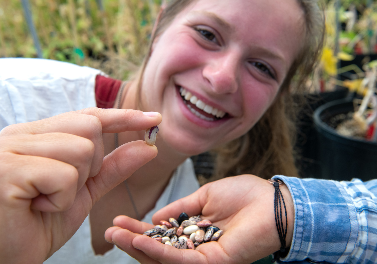 A student holds up a harvest