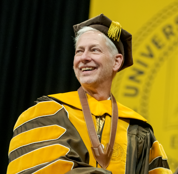 President Seidel smiling at commencement ceremony