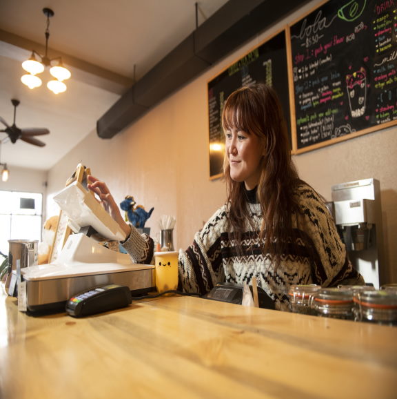 UW Student working a local coffee shop in Laramie