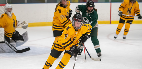 A University of Wyoming student participates in a club hockey game