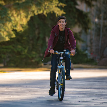A UW student uses a bike rental from the bike library to commute on the University of Wyoming campus
