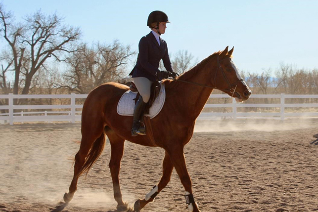 A student participates in a Club Equestrian event
