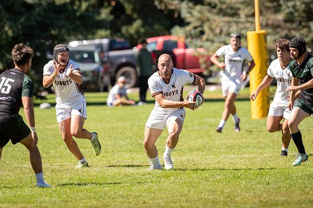 Members of the men's rugby team compete in a competition